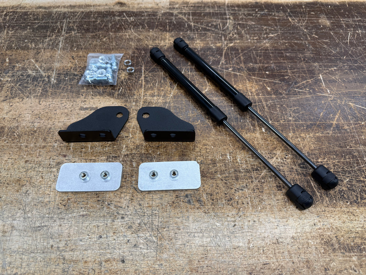 Skillard hood strut kit for 1970–1973 Datsun 240Z with two gas struts, mounting brackets, backing plates and hardware.