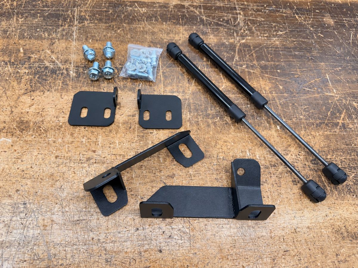Complete Skillard hood strut kit for the 1979–1983 Datsun 280ZX with two struts, upper and lower brackets, ball studs, and installation hardware.