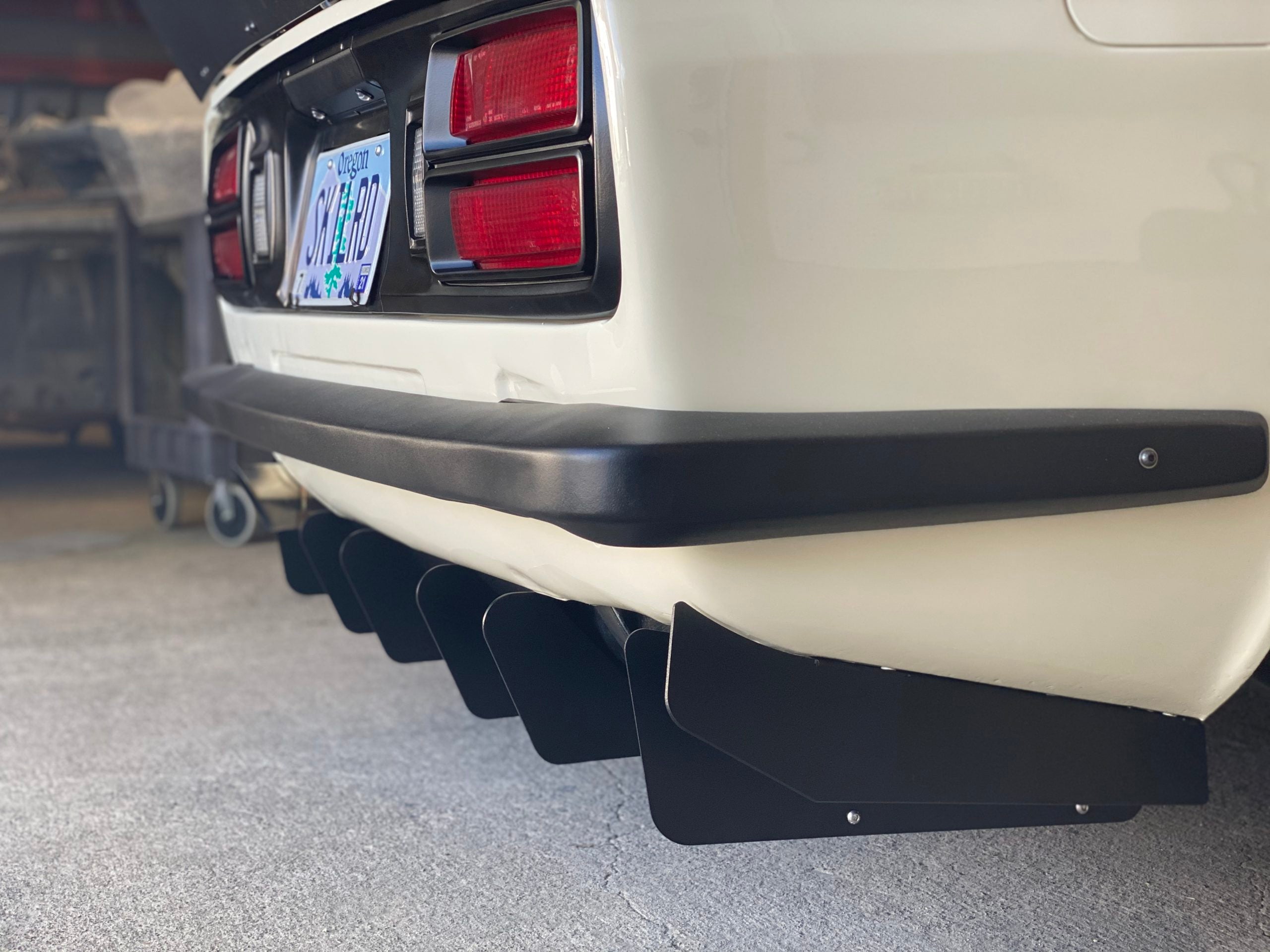 What is the purpose of a rear diffuser? 